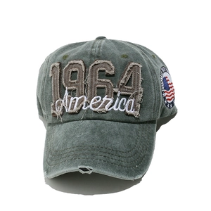 Detail of 1964 America embroidery and distressed washed denim on a vintage baseball cap