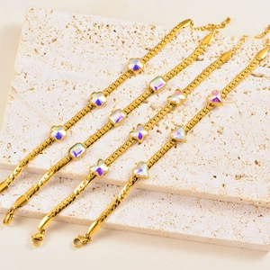 Golden Cuban chain bracelet with colorful stone flower, butterfly and heart charms