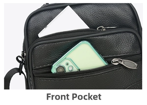 Front pocket of black leather crossbody bag showing space for phone and power bank