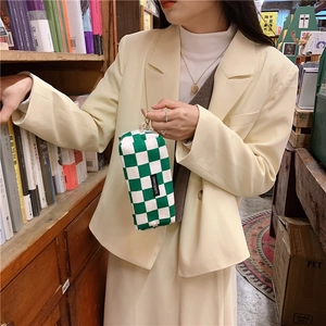 Canvas pencil case with green and white checkerboard pattern and merciparis label