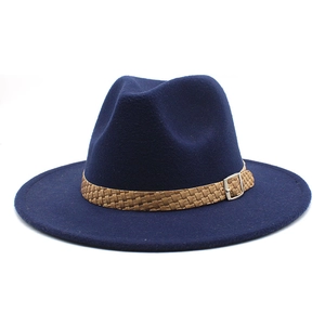 Detail of navy blue felt fedora hat featuring a brown braided band and silver metal buckle