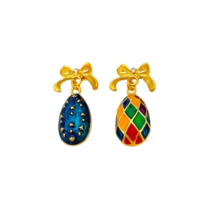 Vintage style egg-shaped earrings with colorful enamel patterns and crystal bows