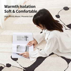 Soft plush bedroom rug featuring large black and white floral pattern for home decor