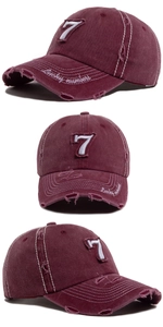 Detailed views of vintage burgundy baseball cap with white number 7 embroidery and distressed holes