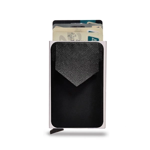 Macro view of RFID-blocking silver aluminum card holder with black Saffiano leather pocket