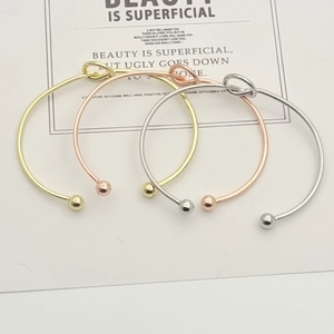 Set of three minimalist open knot bangles in gold, silver, and rose gold finish
