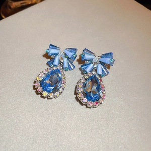 Blue crystal bow waterdrop earrings with full diamond accents and pear-cut gemstones