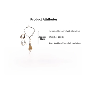 Detail showing jewelry set dimensions with gold metal leaf on brown velvet cord