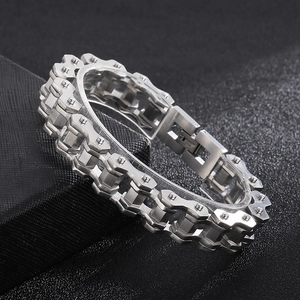 Detailed view of silver stainless steel bicycle chain bracelet on black leather display box