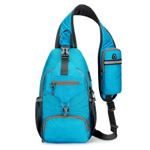 Detail of bright blue nylon chest bag showing water-resistant texture and shoulder strap pouch