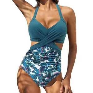 Detail of cross halter neckline and tropical palm leaf print on cutout monokini