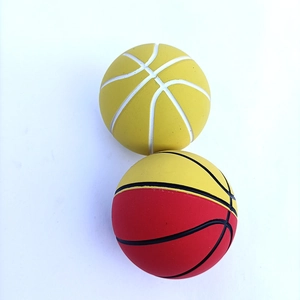 Detailed close-up of yellow and red mini basketball stress balls with high elasticity