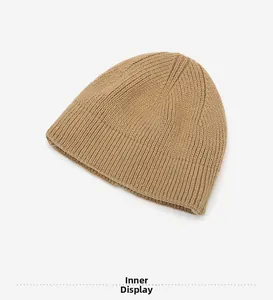 Detailed inside view of khaki ribbed knit beanie showing soft fabric and quality stitching