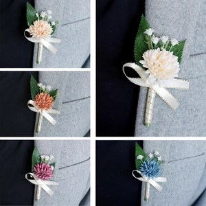 Elegant handmade boutonniere with silk flowers and ribbons for weddings or formal suits