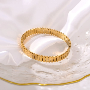 Vertical textured oval cutout cuff bracelet in 18K gold plated stainless steel