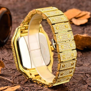 Close-up of gold iced-out watch band with screw details and luxury crystal pavé