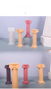 Ionic column scented candles in white, orange, pink and purple for home decoration