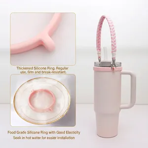Pink 40oz insulated tumbler with woven handle and food-grade thick silicone ring
