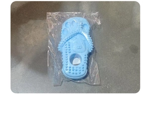 Detail of light blue slipper pet chew toy with textured surface for dog teeth cleaning