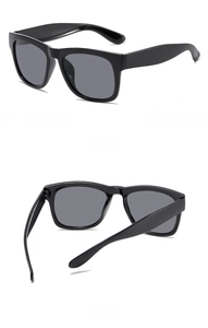Detail of classic black square kids' sunglasses with premium dark grey UV protection lenses