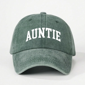 Detail of AUNTIE embroidery on washed dark green cotton twill baseball cap with curved brim