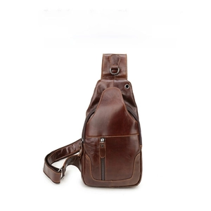 Close-up of vintage brown leather chest bag showing premium texture and zipper detail