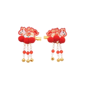 Pair of festive red embroidered hair clips with white pompoms and tassels for New Year