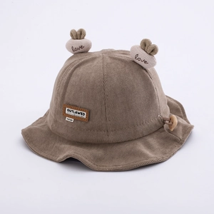 Detail of khaki corduroy baby hat with cute soft ears and adjustable chin strap