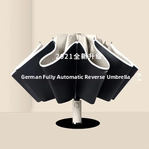 Detail of automatic reverse folding umbrella with gold metallic handle and dual-layer fabric