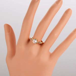 Four-prong gold stainless steel ring with large round zircon stone on model hand