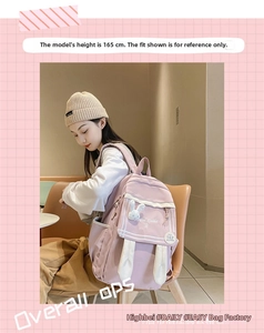 Detailed view of pink canvas backpack featuring cute bunny ears and a plush rabbit charm