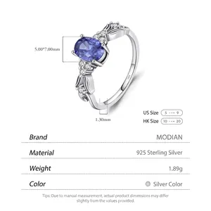 925 sterling silver ring featuring oval blue tanzanite and hollow leaf diamond band