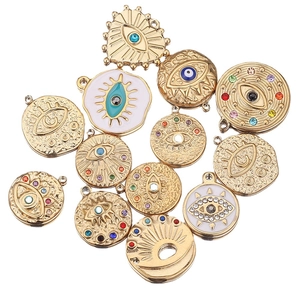 Golden stainless steel evil eye charms set with colorful rhinestones and white enamel