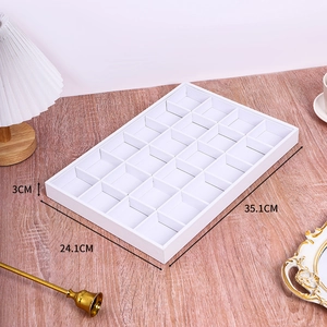 Detail view of white 24-grid jewelry display tray with specific dimensions 35.1x24.1x3cm