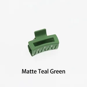 Macro detail of a 4cm matte sage green square hair claw clip with frosted texture