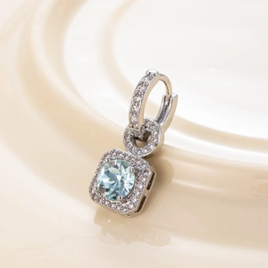 Elegant silver earrings featuring a square pendant with sea blue stone and clear zircons