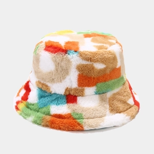 Close-up of colorful plush bucket hat showing soft faux fur texture and multi-color patterns