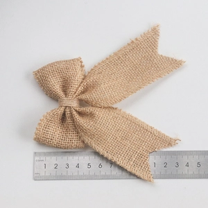 Handmade burlap bow tie with natural jute fiber texture and frayed edge detail