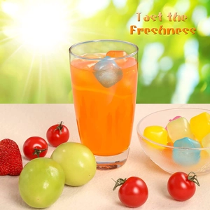 Reusable colorful plastic ice cubes in a glass of juice with a fresh summer vibe