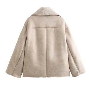 Close-up of faux suede texture and warm sherpa fleece collar on a beige jacket