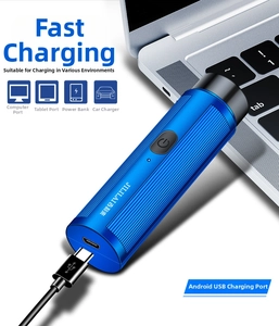 Micro-USB charging detail of blue metallic electric shaver with power indicator
