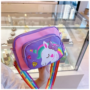 Close-up of cute cartoon unicorn kid crossbody bag with rainbow strap and purple details