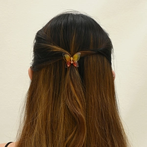 3.5cm butterfly hair claw clip with gradient amber acetate finish on brunette hair