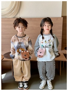 Children's bear-shaped crossbody bags in brown and pink shown on young models