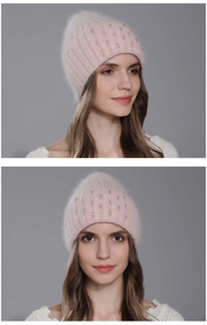 Detail of pink knitted rabbit fur hat with sparkling sequins and soft plush texture
