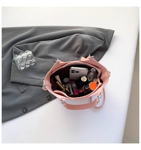 Top-down view of the pink bucket bag interior showing spacious storage for makeup and phone