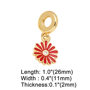 Detail view of 18k gold plated flower charm with red enamel, dimensions 26x11mm