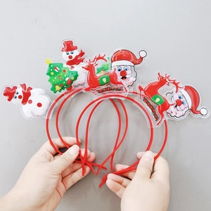 Close-up of cute Christmas headbands with Santa, reindeer, and snowman charms