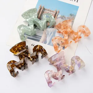 Set of four acetic acid marble texture shark hair claws with wavy edges for women