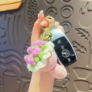Handmade crochet flower bouquet keychain with pink rose, green leaves and small bell
